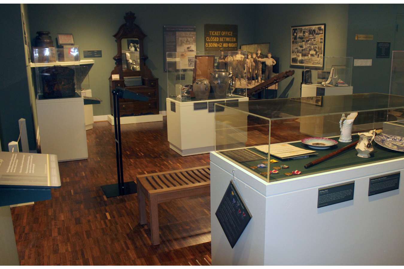 4 Lycem : Display Case layout with "Docent Card" interpreting case artifacts
