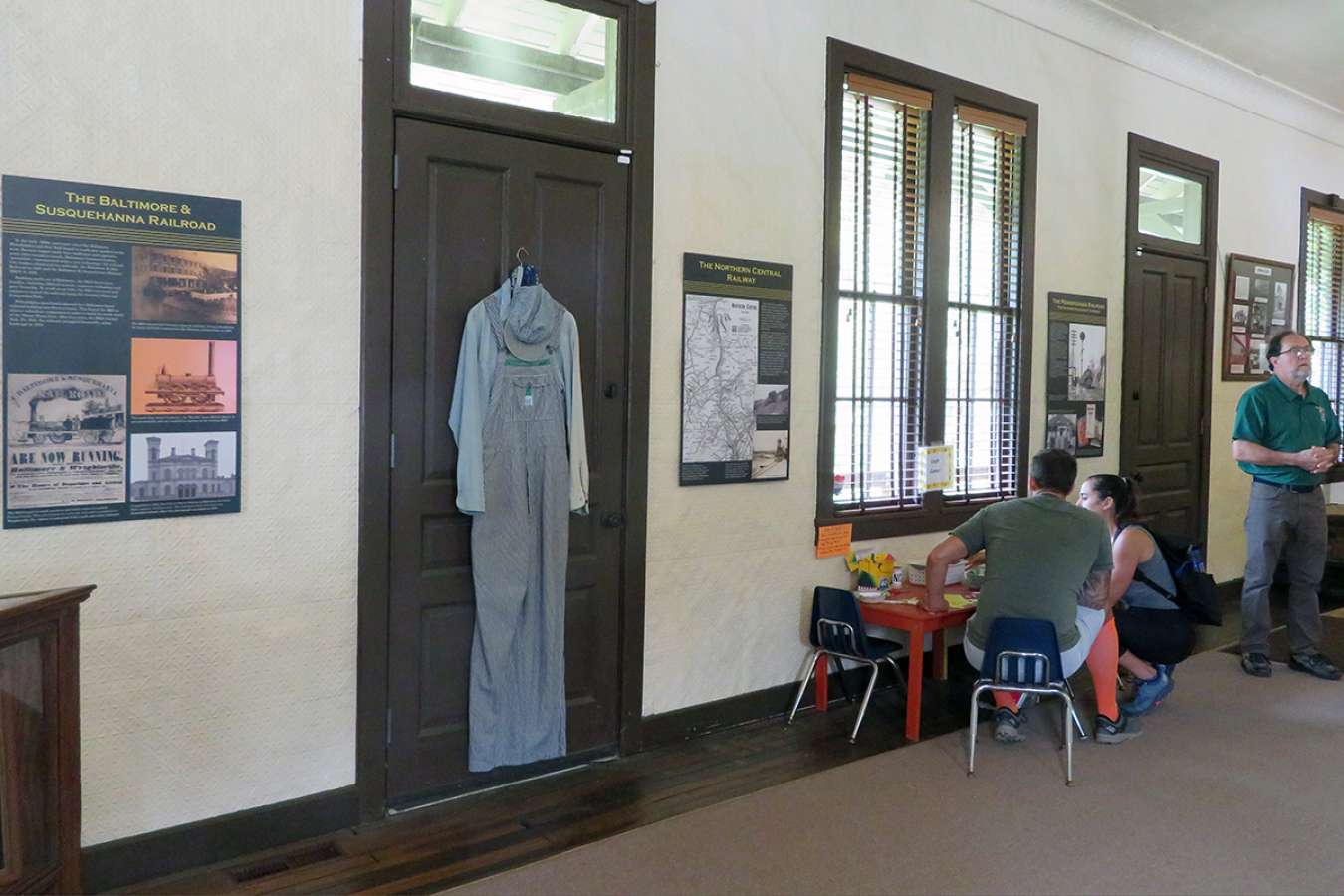 Monkton 1 : Monkton Train Station panels hang with magnets on original tin-tiled wall to protect historic surface